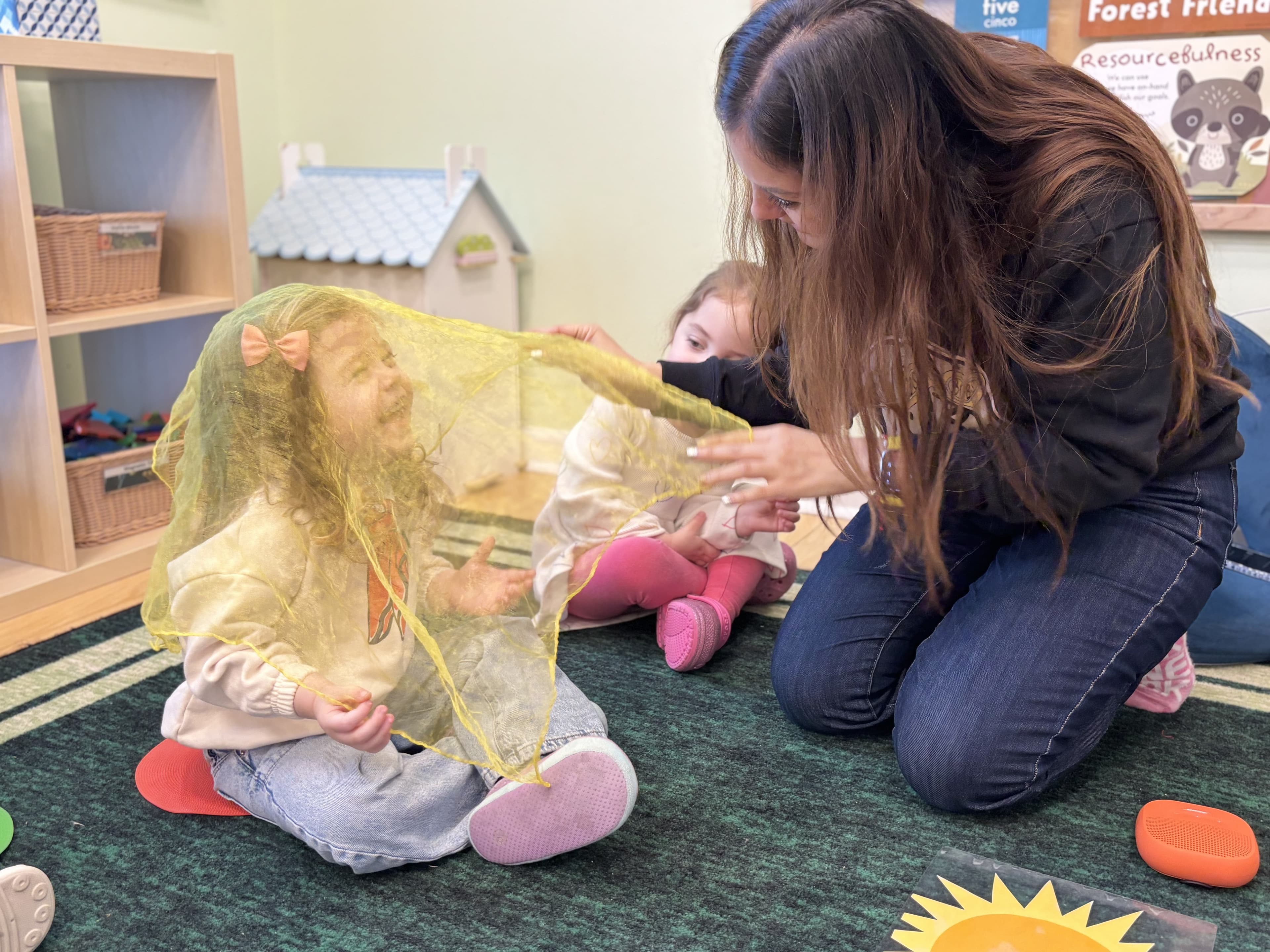 Kinder Prep educators engaging with children in the classroom